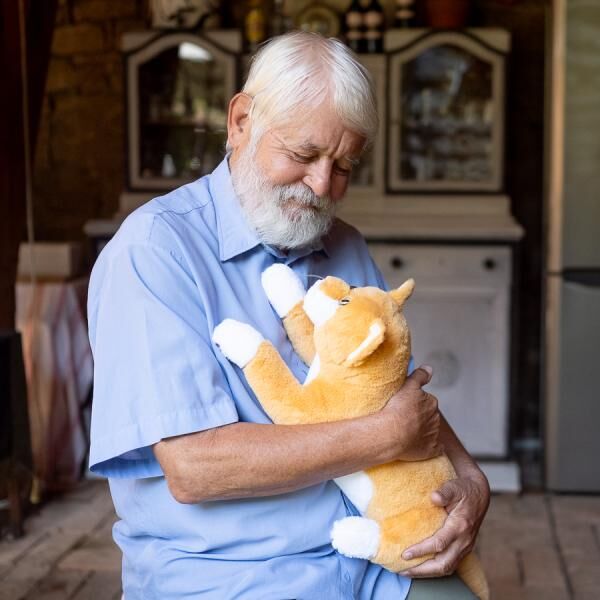 RobiCare® interaktive Therapiekatze "orange-weiß" Demenz-Plüschtier, mit Bewegungssensor